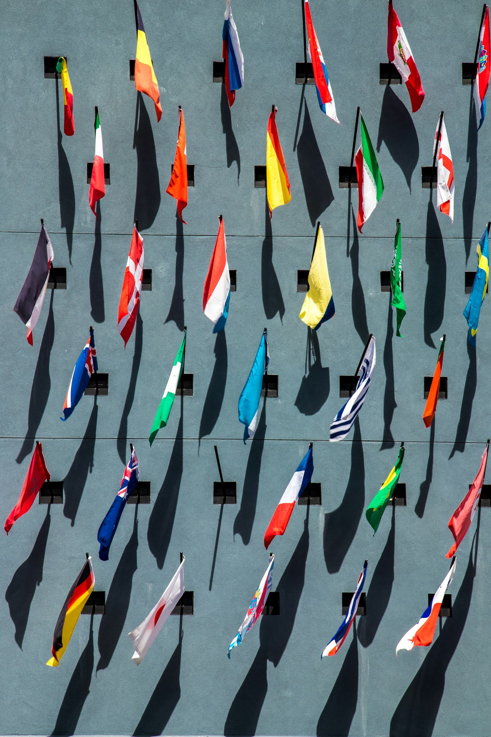 Flags of many countries on a wall, representing language and region targeting